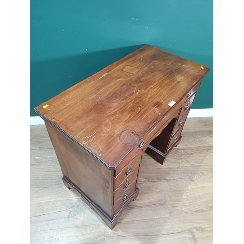 431 - A 19th Century mahogany Kneehole Desk fitted long drawer above recessed cupboard door and three draw... 