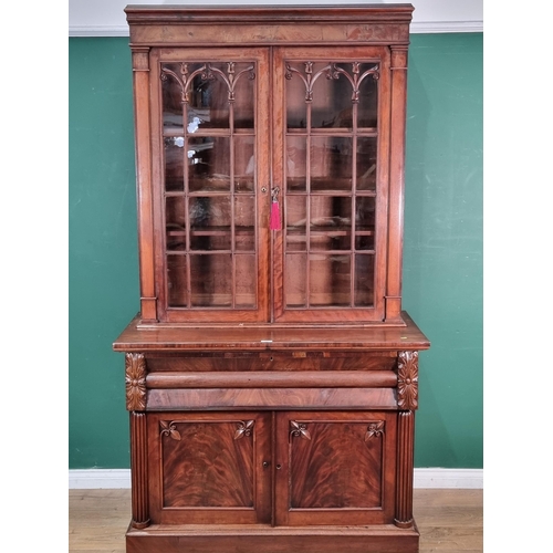 788 - A 19th Century mahogany Secretaire Bookcase, the upper section with pair of glazed doors enclosing t... 