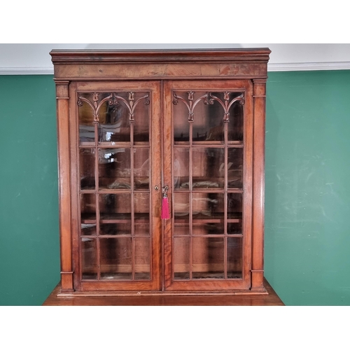 788 - A 19th Century mahogany Secretaire Bookcase, the upper section with pair of glazed doors enclosing t... 