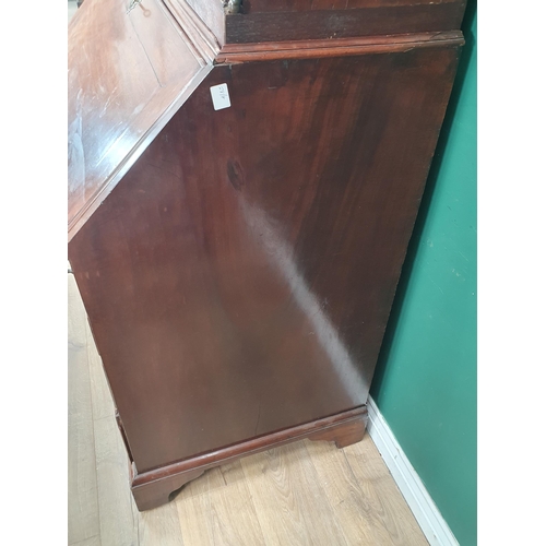 790 - A Georgian mahogany Bureau Bookcase, the upper section with mirror panelled doors, enclosing adjusta... 