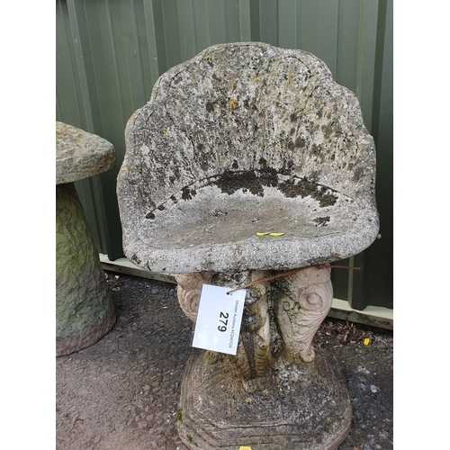 704 - A pair of composite stone Grotto Seats with shaped backrests raised on stylised Lion supports and he... 