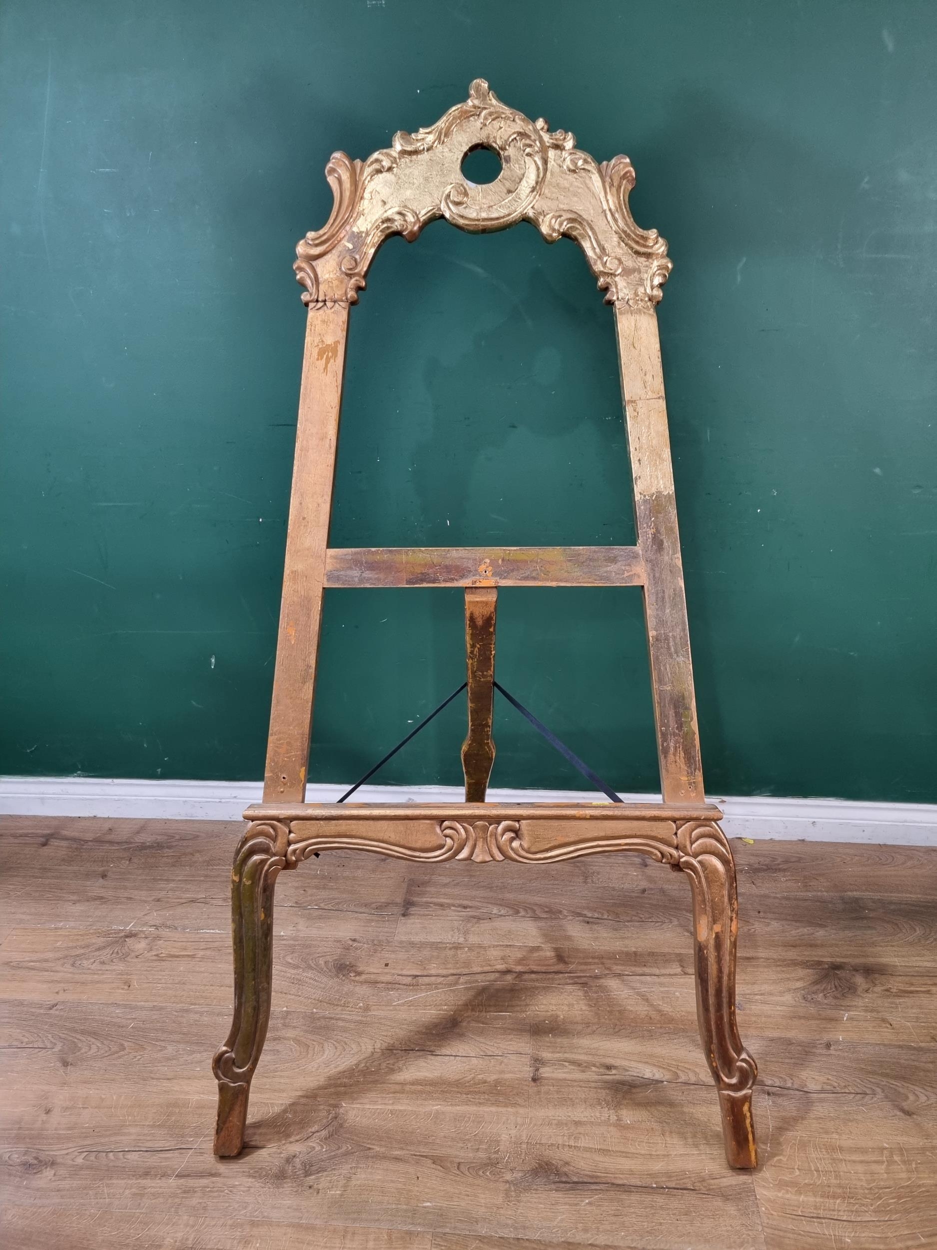 A gilt painted Easel, 5ft 4"High x 2ft 5"Wide. (R8).