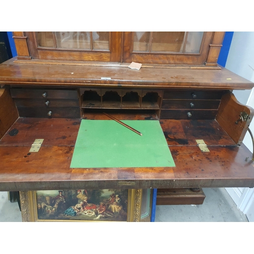 788 - A 19th Century mahogany Secretaire Bookcase, the upper section with pair of glazed doors enclosing t... 