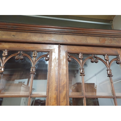 788 - A 19th Century mahogany Secretaire Bookcase, the upper section with pair of glazed doors enclosing t... 