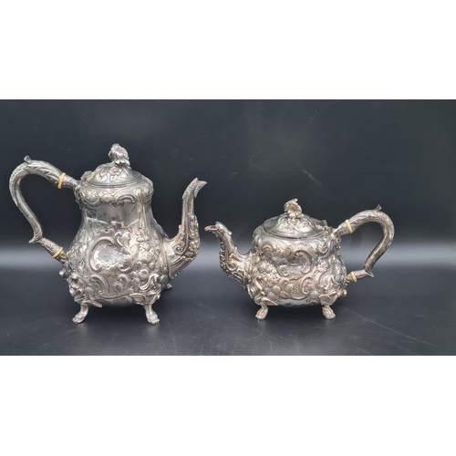 100 - A Victorian silver four piece Tea & Coffee Service with floral and scroll embossing, engraved initia... 