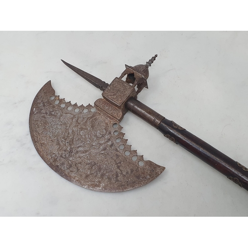 1047 - A Indian axe, circa mid 19th century, the head with chiselled designs on each side, the socket forme... 