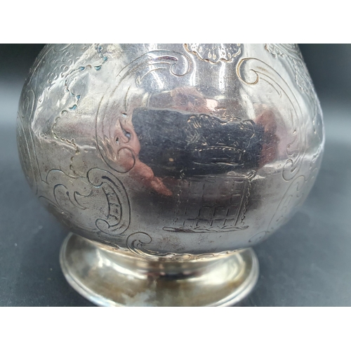 105 - A Victorian silver baluster Hot water Jug with scroll engraving and Somerset crest of ducal coronet ... 