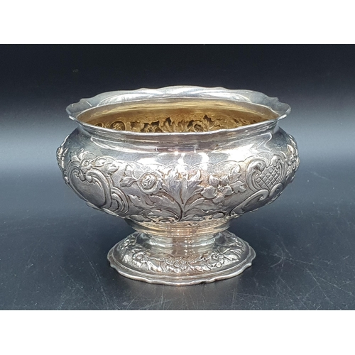 107 - A Victorian silver Sugar Bowl with floral and leafage scroll embossing, engraved Somerset crest with... 