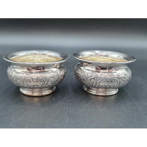 11 - A pair of George IV silver small Bowls with floral and scroll embossed and chased frieze with vacant... 