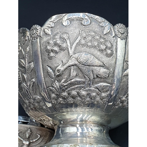 12 - An Indian silver Bowl embossed and chased figures and birds, 4 1/2in, an embossed Pepperette, Cigare... 