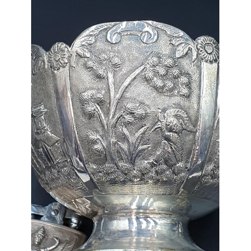 12 - An Indian silver Bowl embossed and chased figures and birds, 4 1/2in, an embossed Pepperette, Cigare... 