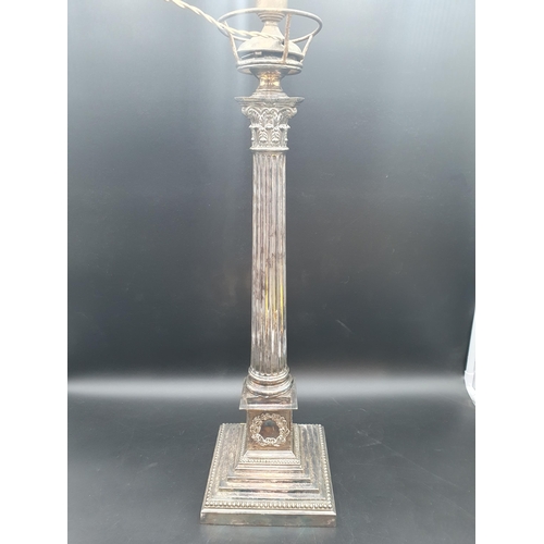 21 - A large plated Table Lamp with fluted column having Corinthian capital on square beaded base with va... 