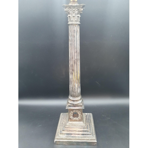 21 - A large plated Table Lamp with fluted column having Corinthian capital on square beaded base with va... 