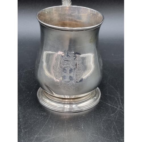 23 - A George II silver baluster Mug engraved coat of arms, leafage scroll handle, London 1748, maker: RB... 