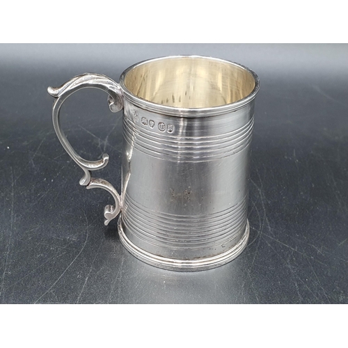 3 - A Victorian silver Christening Mug with reeded bands and leafage scroll handle,London 1838, maker: J... 