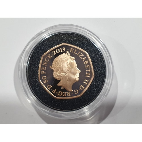 311 - A 2019 Paddington at St Pauls gold proof 50 Pence, in case, with COA