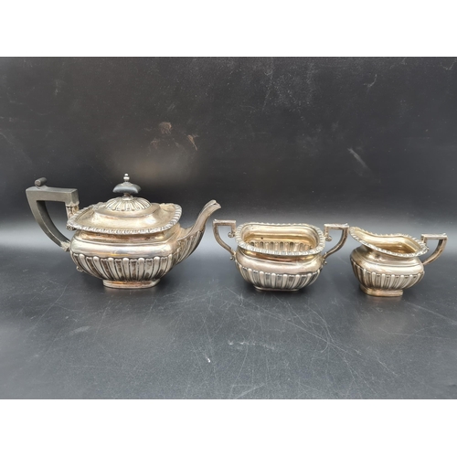 33 - A Victorian silver three piece Tea Service of semi-fluted boat shape, Birmingham 1900, 605gms all in