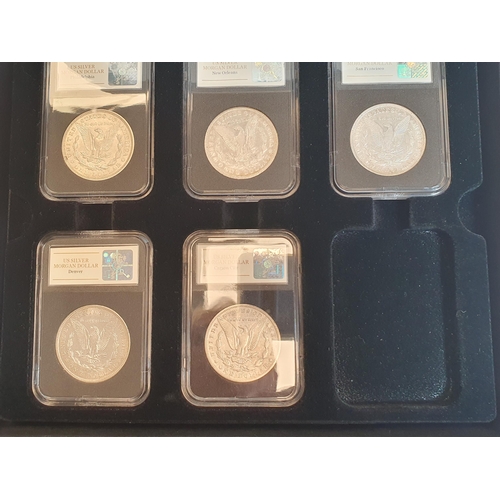 418 - A Collection of US Silver Morgan Dollars, consisting of a 1921 Philadelphia, an 1886 New Orleans, a ... 