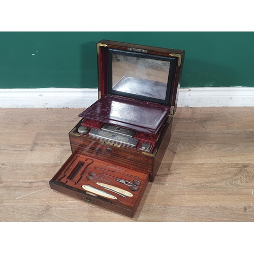 523 - A 19th Century Coromandel Vanity Box with brass mounts with hinged cover enclosing mirror, glass bot... 