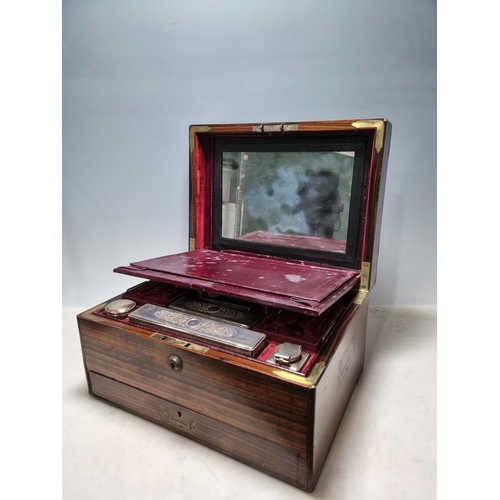 523 - A 19th Century Coromandel Vanity Box with brass mounts with hinged cover enclosing mirror, glass bot... 