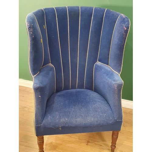 530 - A George III barrel back Armchair with blue upholstery raised on turned supports and casters 3ft 8in... 