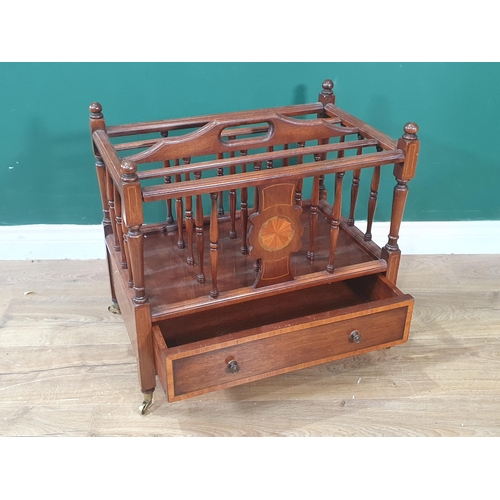 534 - An Edwardian mahogany Canterbury with spindle turned divisions, medallion inlay on turned legs and c... 