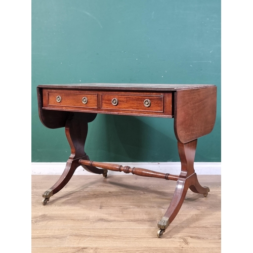 537 - A 19th Century mahogany Sofa Table fitted two drawers on cheval frame with solid baluster end suppor... 