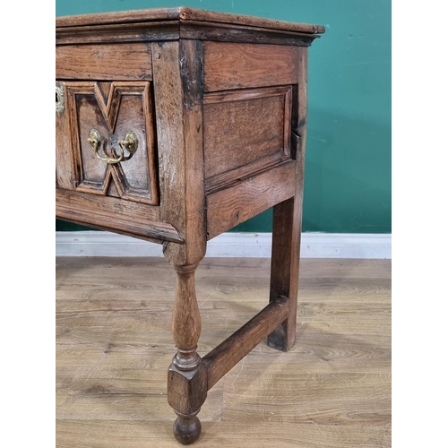 540 - An antique oak Dresser Base in the Jacobean style fitted two drawers with moulded fronts on baluster... 