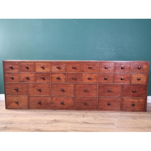 542 - A 19th Century bank of Apothecary Drawers fitted two rows on nine small drawers above two rows of si... 