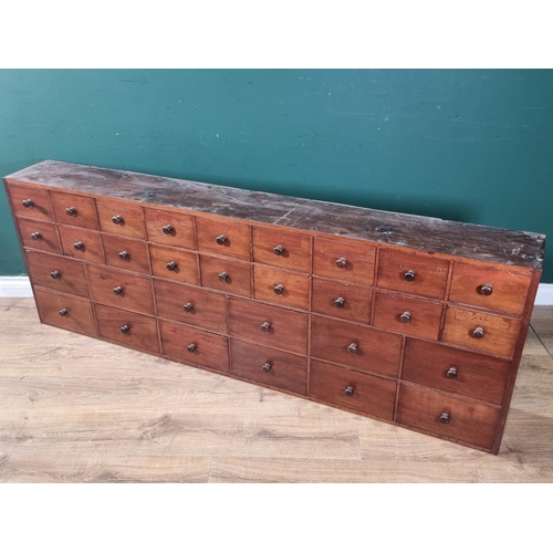 542 - A 19th Century bank of Apothecary Drawers fitted two rows on nine small drawers above two rows of si... 