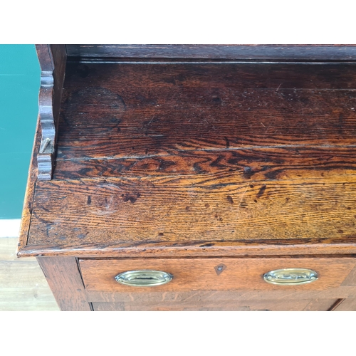 547 - An early 19th Century oak Dresser and Rack, the base fitted six drawers and two cupboard doors raise... 