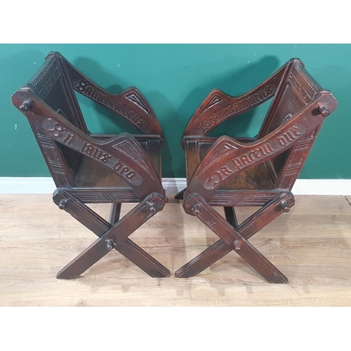 548 - A pair of 19th Century oak Glastonbury Chairs with carved backs and arms on cross frames