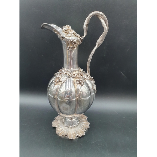 55 - A William IV silver Claret Jug and Stopper with fruiting vine decoration and entwined handle on fine... 