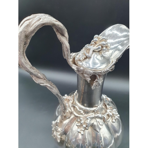 55 - A William IV silver Claret Jug and Stopper with fruiting vine decoration and entwined handle on fine... 