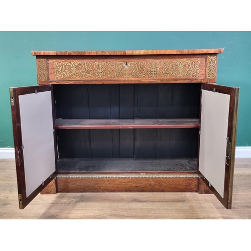 554 - A Regency brass inlaid rosewood Secretaire Cabinet with a fitted frieze drop front drawer above a pa... 