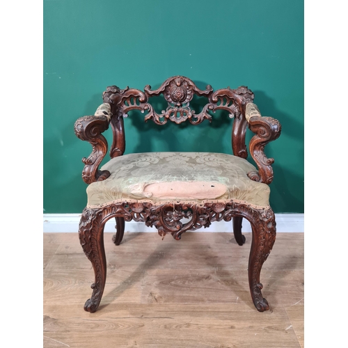 556 - ****Amendment****
A late 18th/early 19th Century walnut Armchair with foliate and scrolled pierced l... 