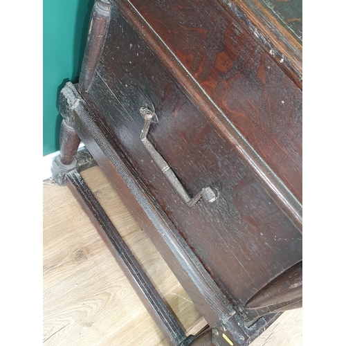 557 - An antique oak Coffer on Stand with moulded hinged cover and fitted two candle boxes to the interior... 