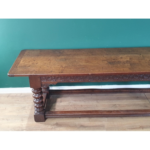 560 - A large, old, oak Refectory Table, the three-plank rectangular cleated top above carved scroll flora... 