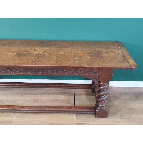 560 - A large, old, oak Refectory Table, the three-plank rectangular cleated top above carved scroll flora... 