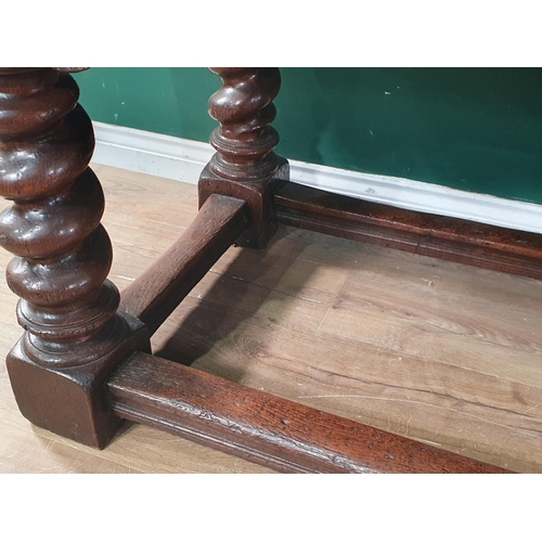 560 - A large, old, oak Refectory Table, the three-plank rectangular cleated top above carved scroll flora... 