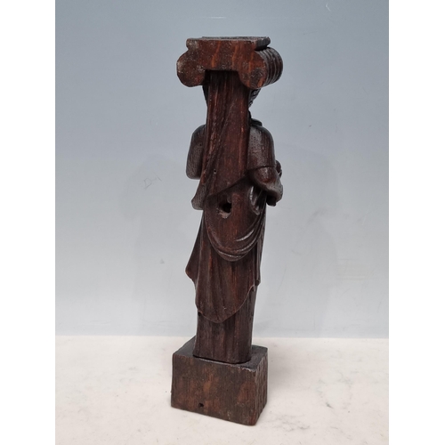 562 - A 17th Century oak Figural Caryatid/Term in the form of a maiden wearing dress robes, 1ft High x 3