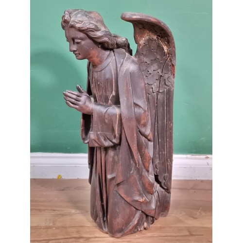 563 - An 18th Century carved walnut winged Roof Angel wearing robes, A/F, 2ft 2