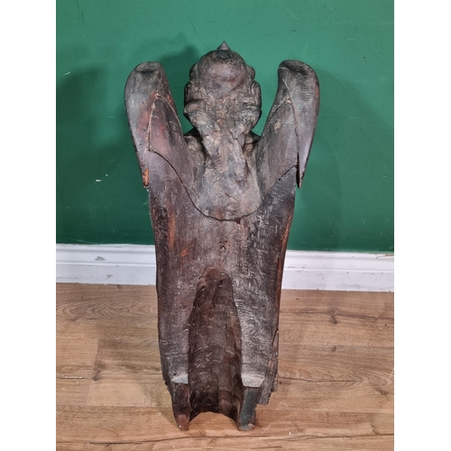 563 - An 18th Century carved walnut winged Roof Angel wearing robes, A/F, 2ft 2