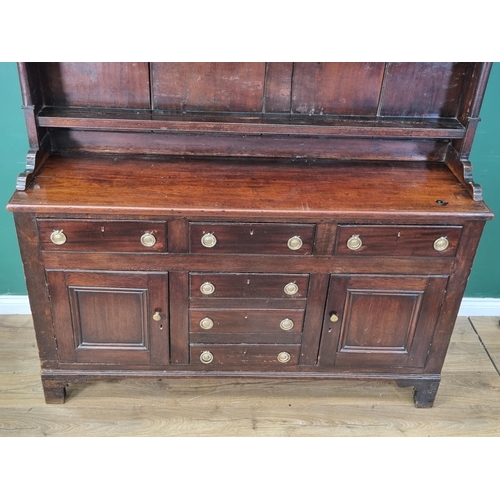 566 - A 19th Century mixed woods Dresser and Rack, the rack with carved frieze above shelves, the base fit... 