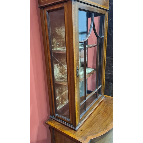 570 - An Edwardian mahogany Display Cabinet with crossbanding and inlaid frieze of urn and scrolls above a... 