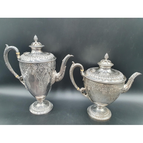 58 - A Victorian silver four piece Tea and Coffee Service of classical urn form, finely engraved flowers ... 