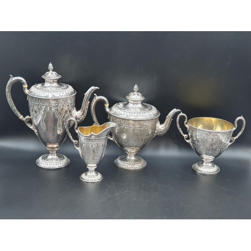 58 - A Victorian silver four piece Tea and Coffee Service of classical urn form, finely engraved flowers ... 