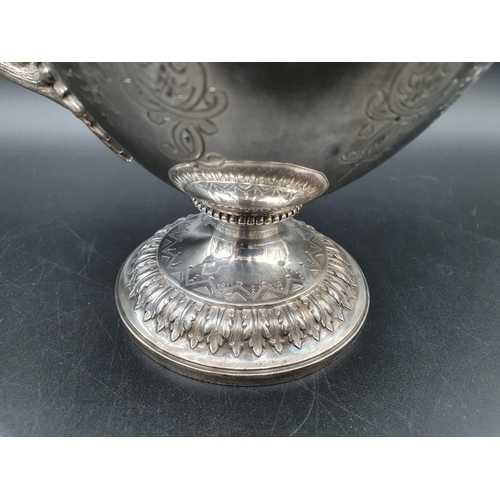 58 - A Victorian silver four piece Tea and Coffee Service of classical urn form, finely engraved flowers ... 