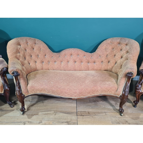 588 - A Victorian matched mahogany three piece Suite with button back upholstery, to include a double spoo... 