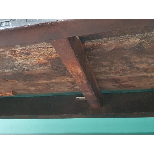 590 - A 17th Century oak Refectory Table with cleated thick three plank top above carved frieze to one sid... 